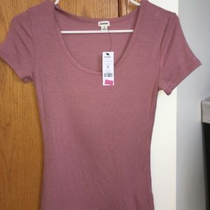 Dusty pink tight fitting tee with a scooped neck